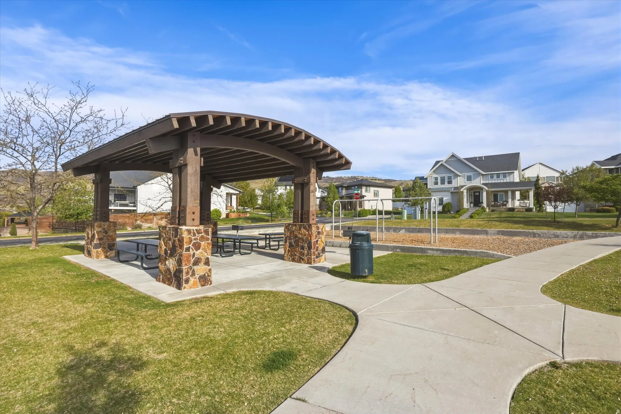 View of property's community playground and pavilion