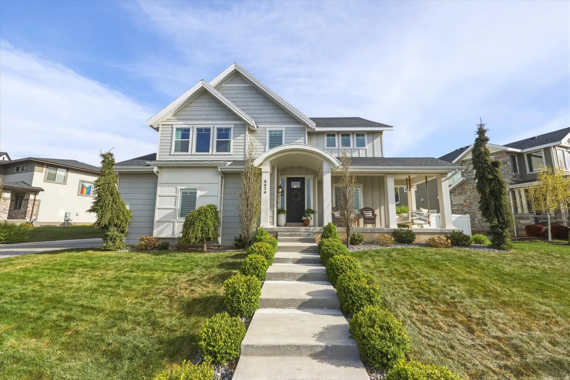 View of front of home with a front yard and a porch