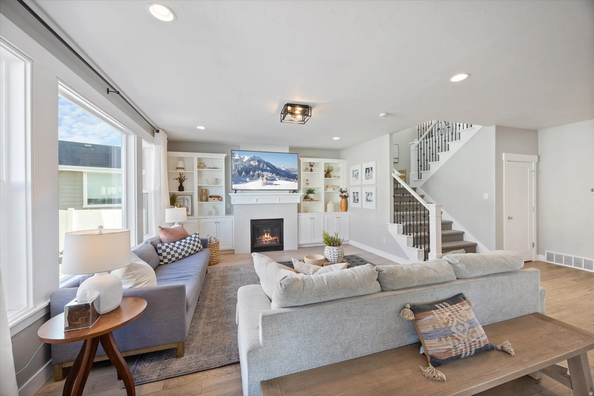 Family room with views of wide staircase