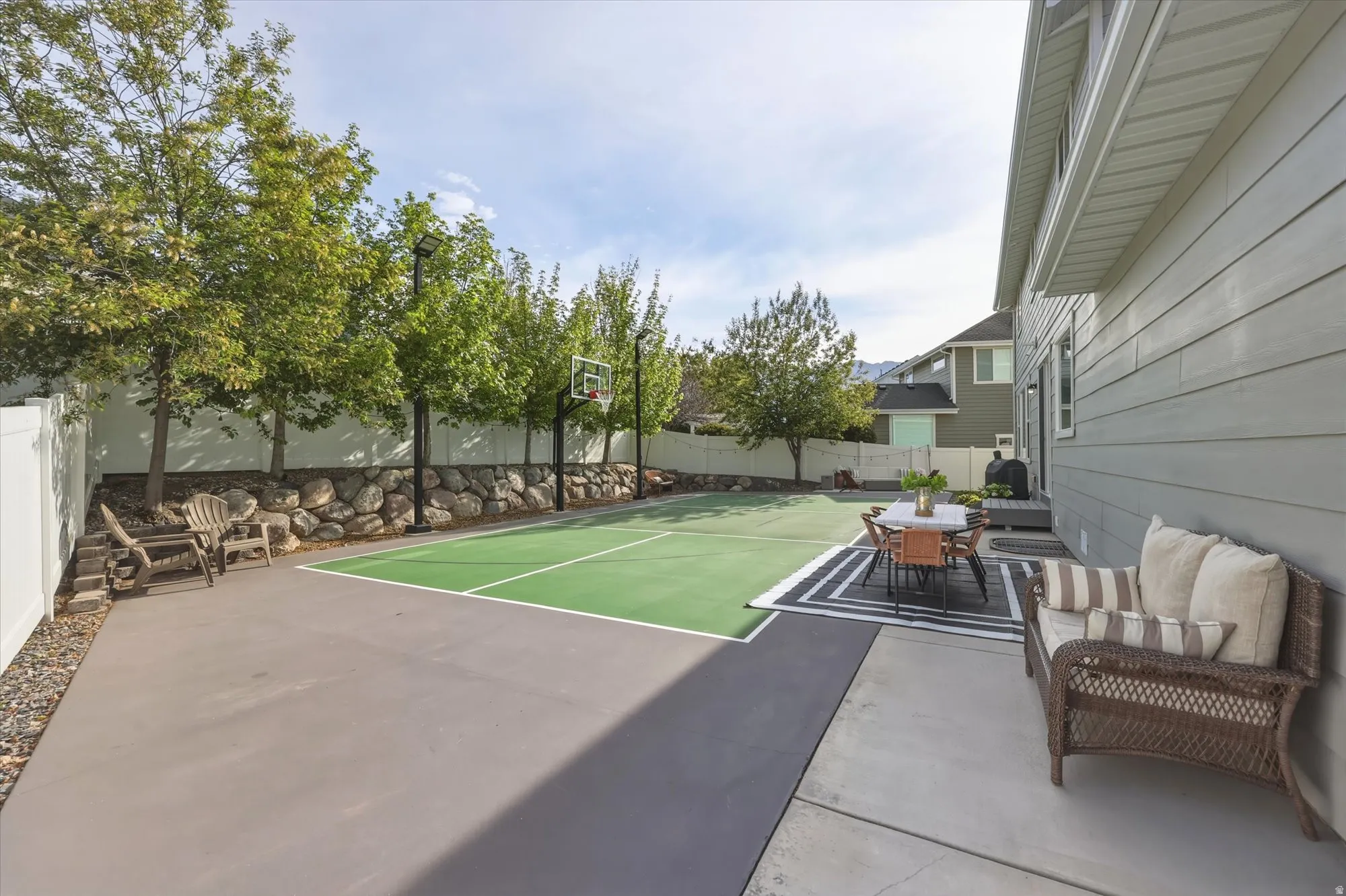 Enjoy your private pickleball/sports court!  The mature trees provide a beautiful back drop and lots of privacy!