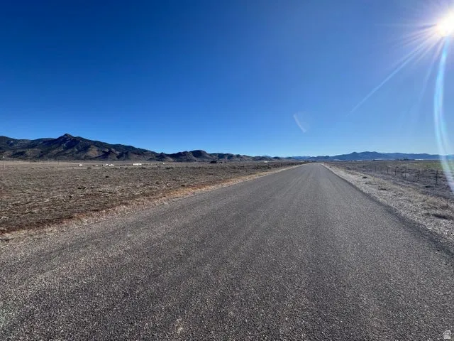 View of asphalt road featuring a mountain view