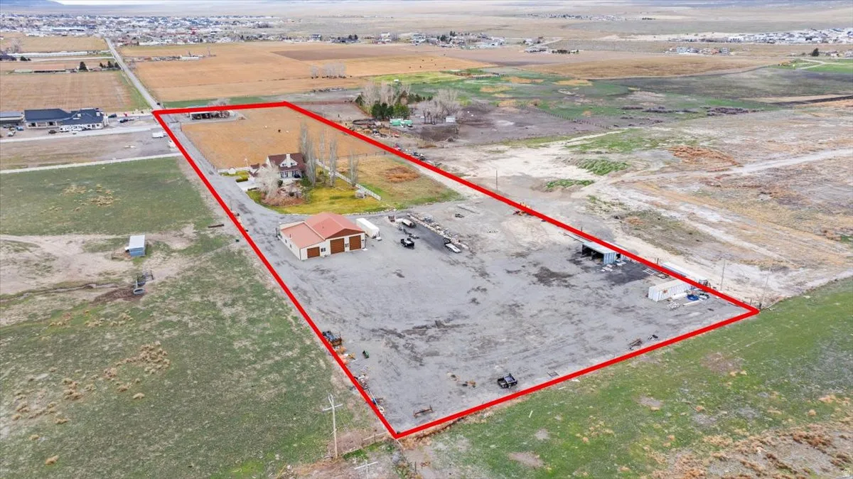 Aerial view of sparsely populated area with property boundaries highlighted