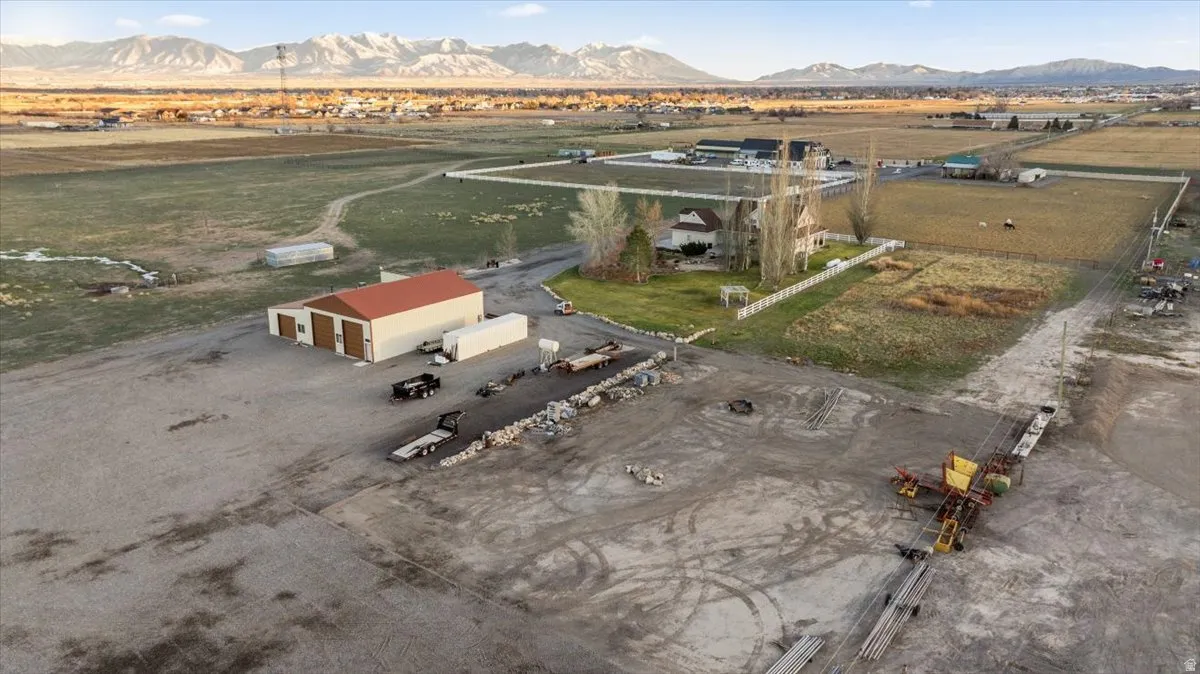 Aerial view of property's location with a mountainous background and rural landscape
