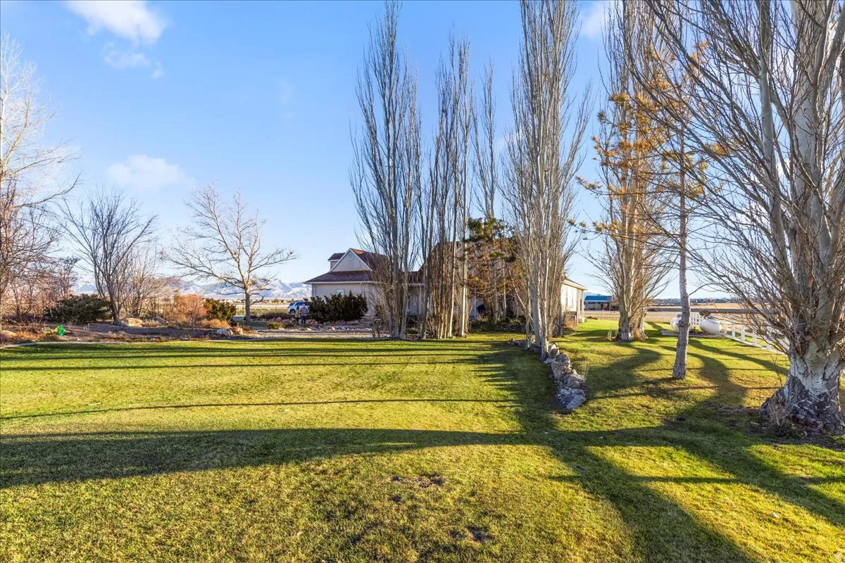 View of property's community featuring a yard