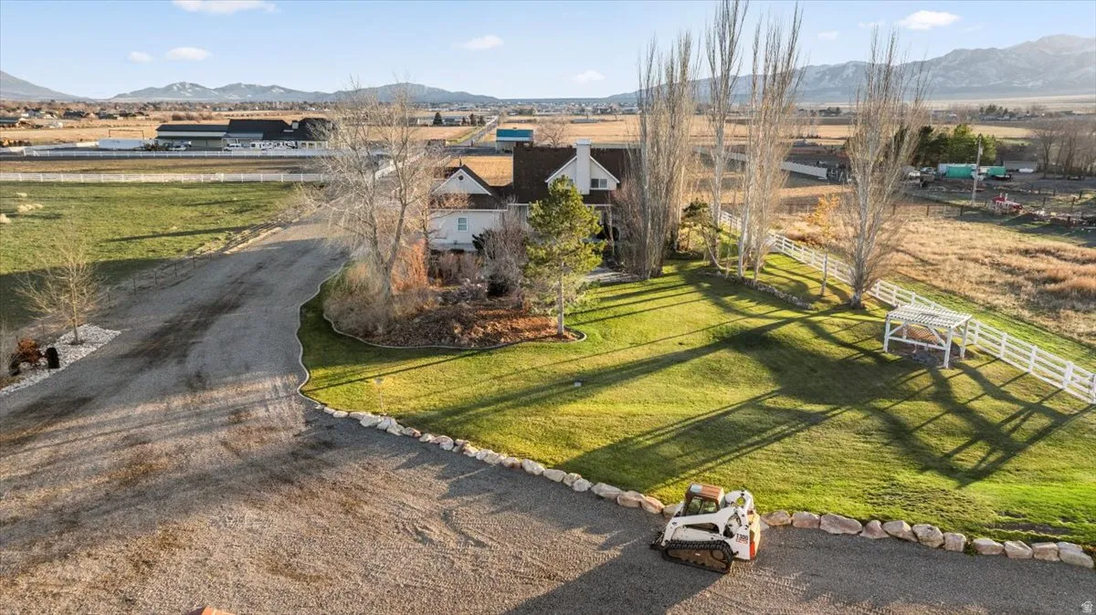 View of home's community with a mountain view and a yard