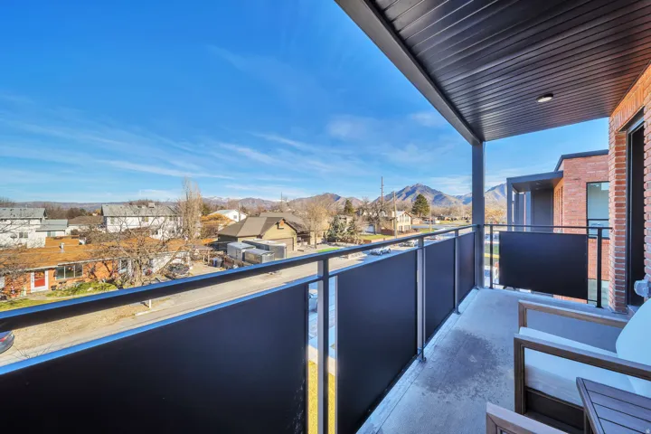 Balcony with a mountain view and a residential view