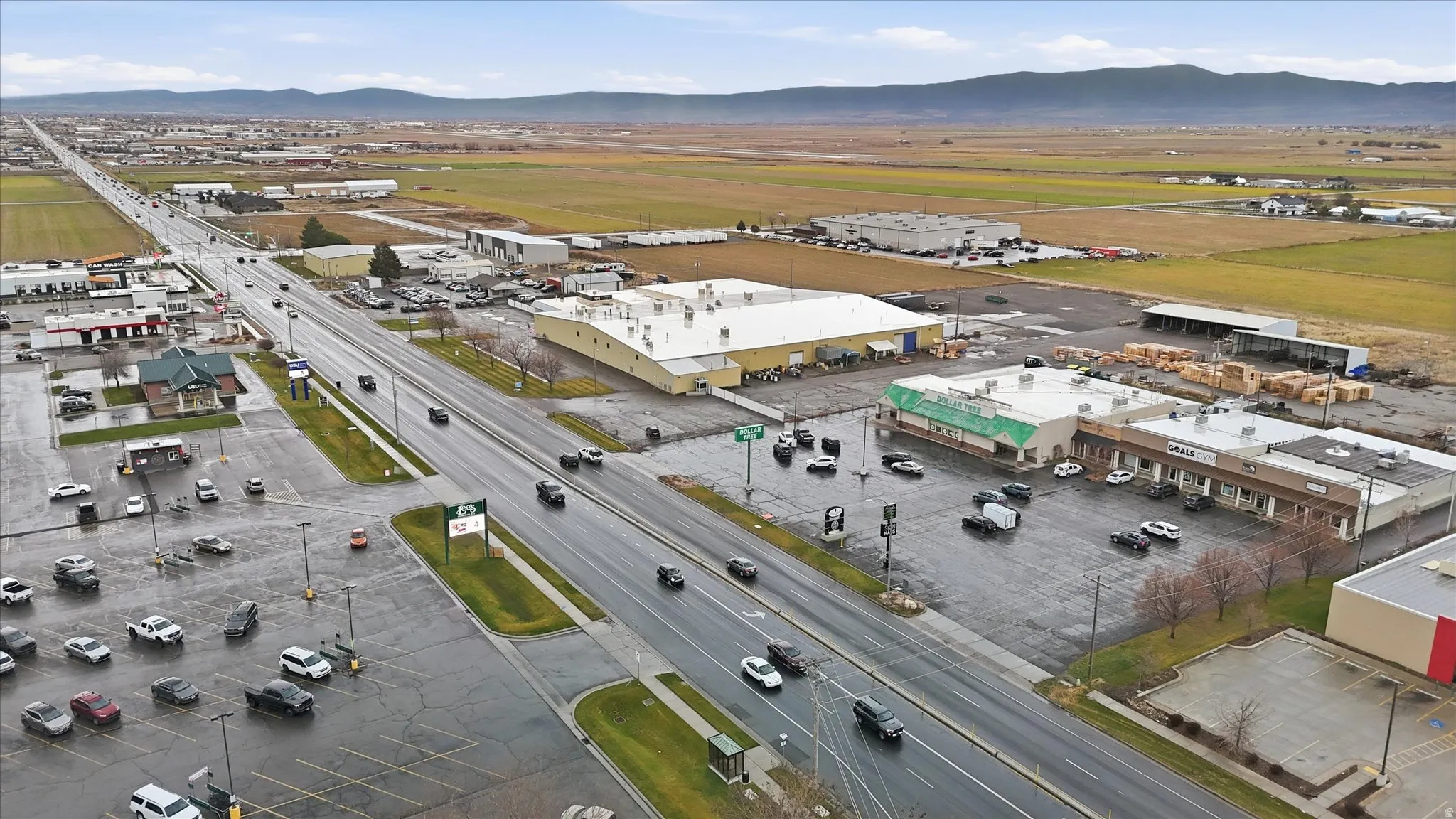 Aerial view of an industrial area and a mountainous background