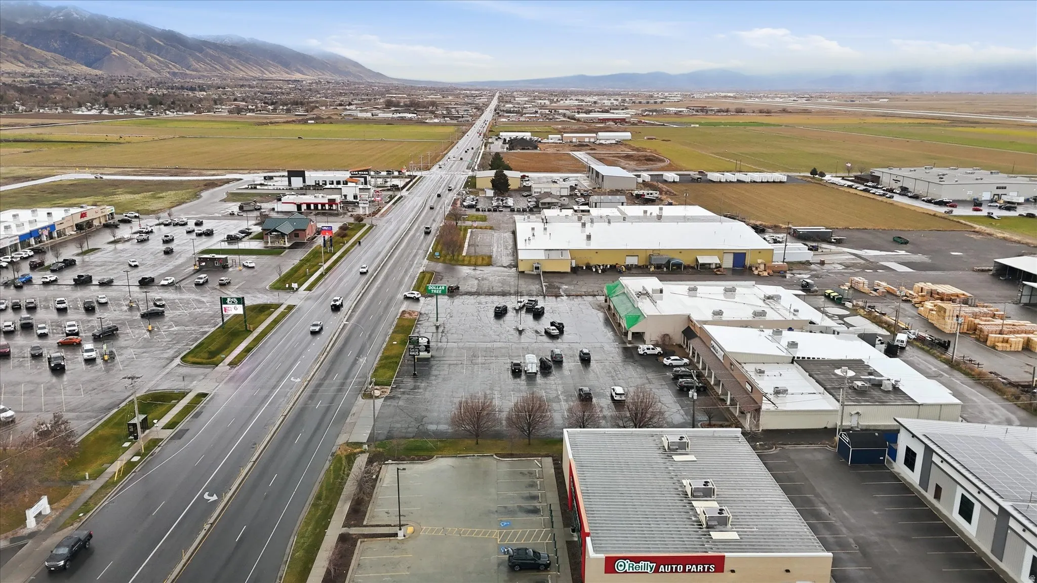 Drone / aerial view of an industrial area and a mountainous background