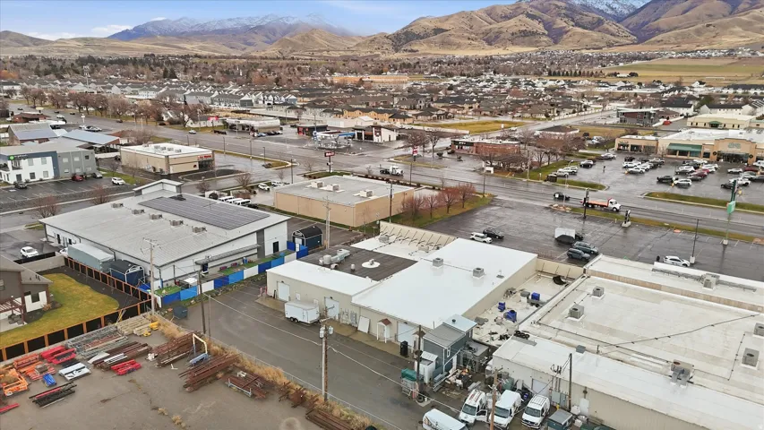 Drone / aerial view of an industrial area and a mountainous background