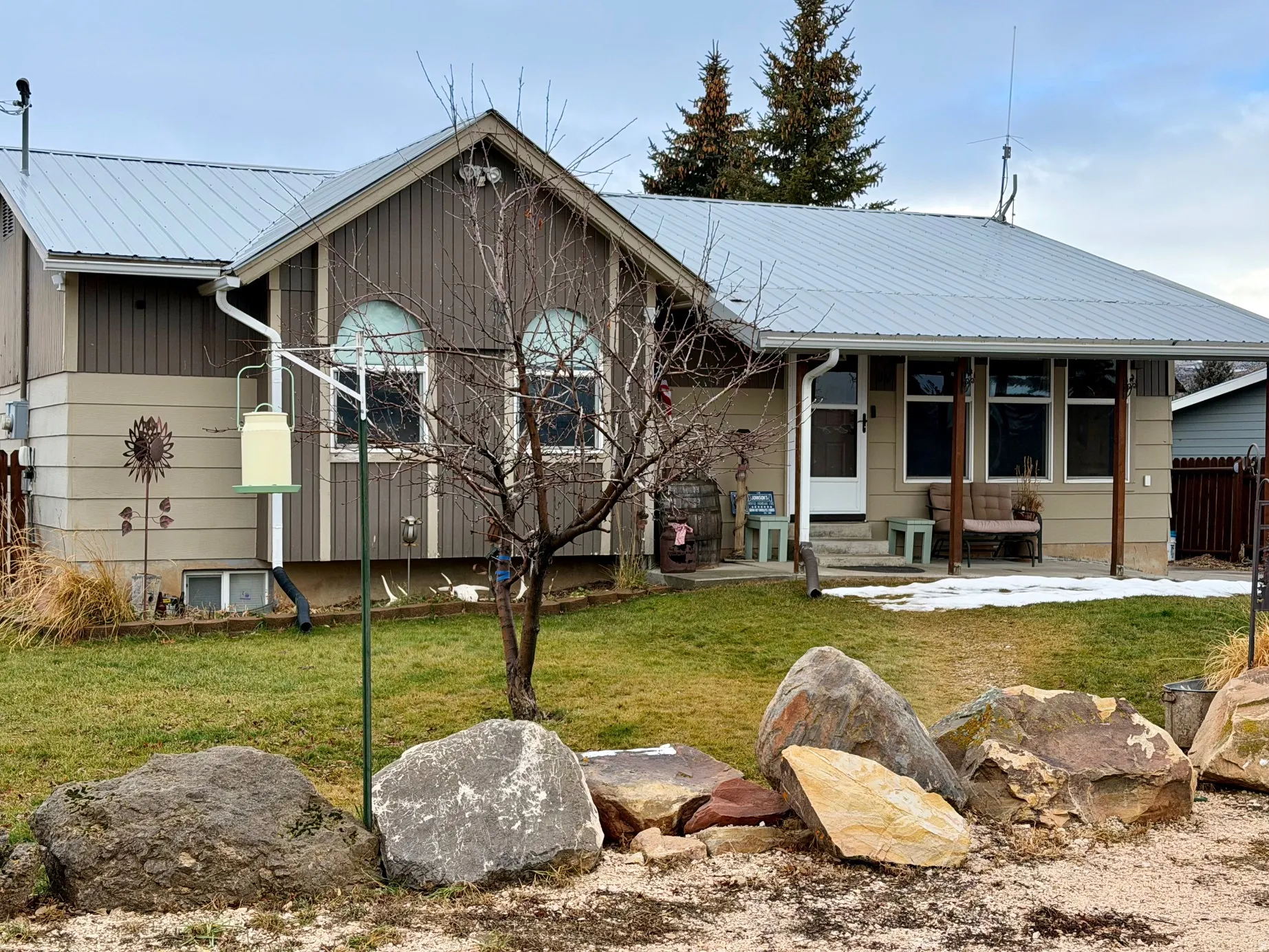 View of front of property featuring a metal roof and a covered porch