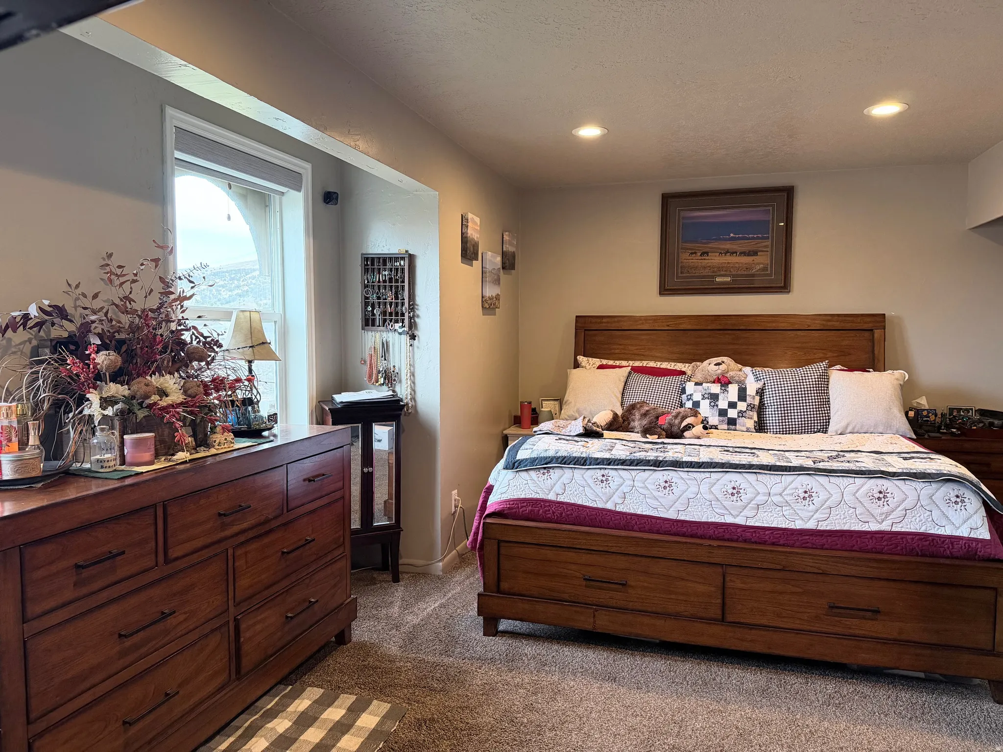 Bedroom featuring dark colored carpet