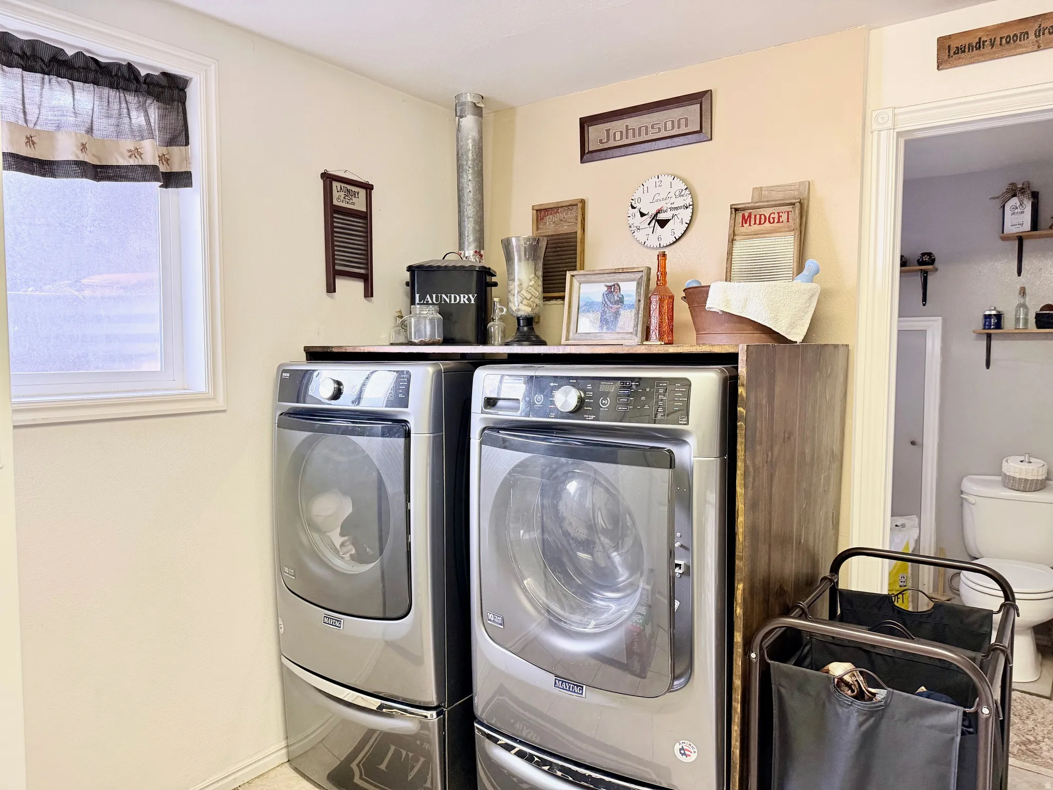 Laundry area featuring washer and clothes dryer