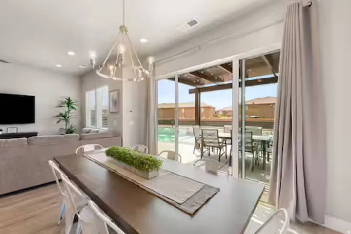 Dining room with a chandelier, recessed lighting, and light wood finished floors
