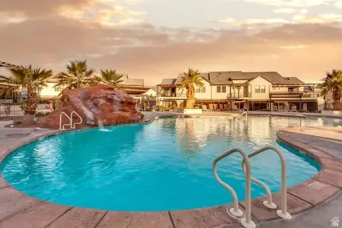 Community pool with a patio