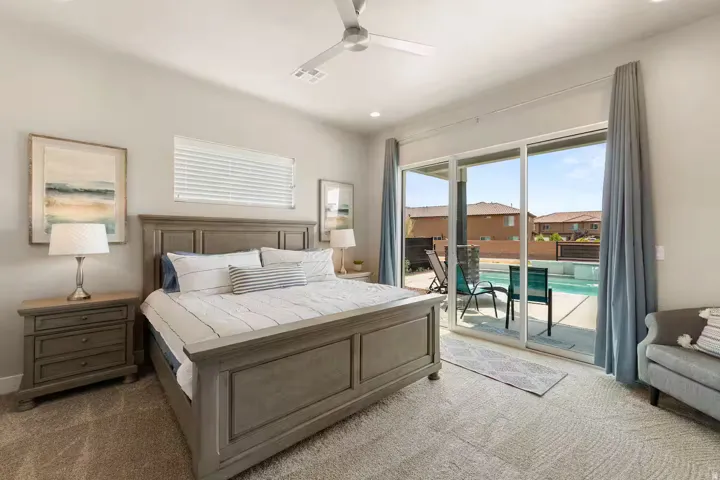 Carpeted bedroom featuring a ceiling fan, recessed lighting, and access to outside