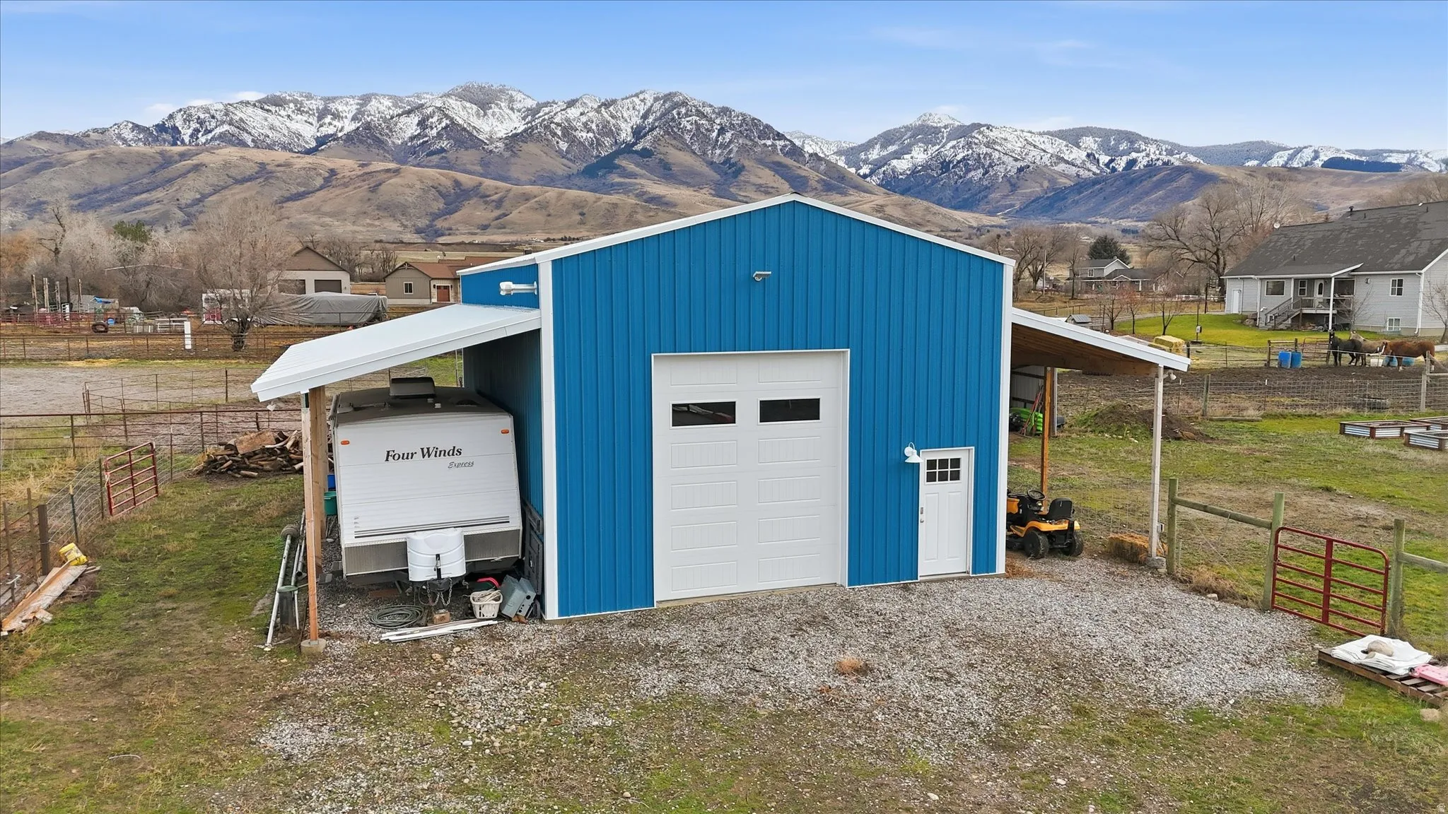 Garage featuring a mountain view and a detached garage