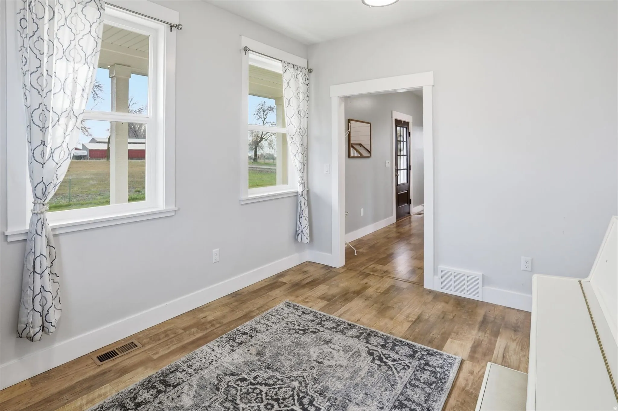 office or sitting room with light wood finished floors and baseboards