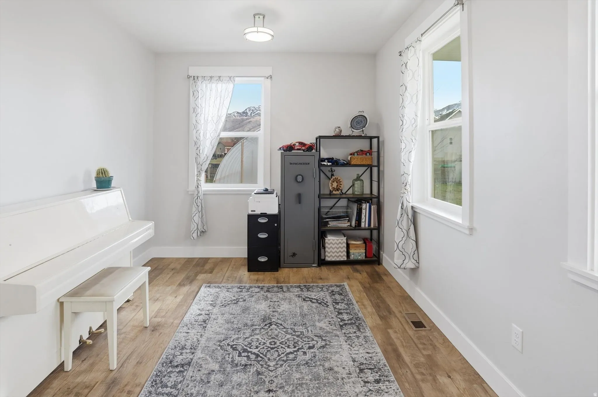 Office area with light wood-style floors