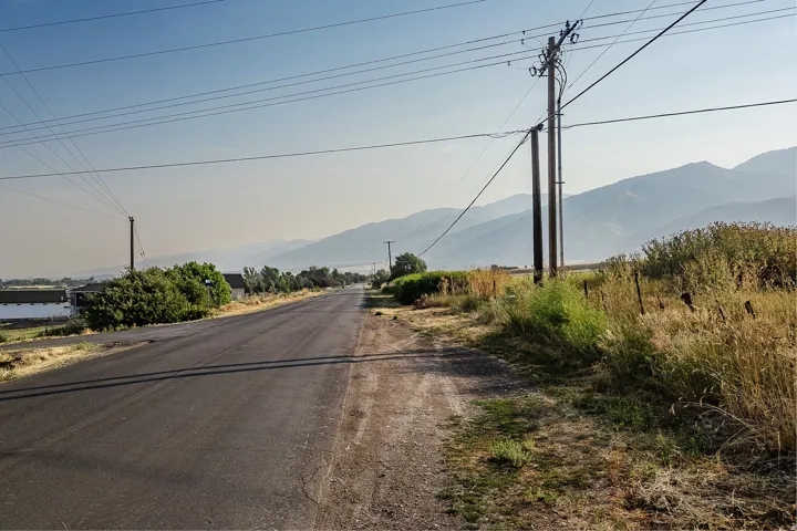View of asphalt street with a mountain view