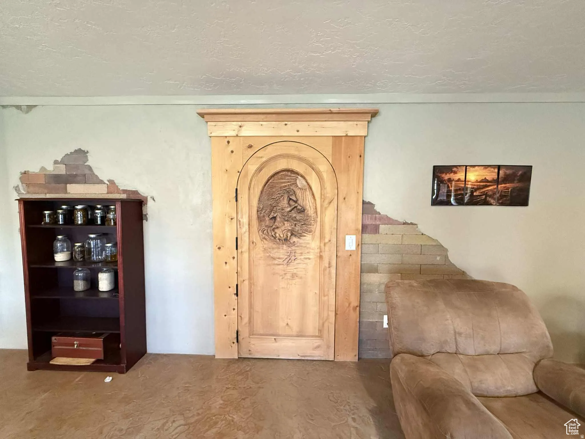Living area featuring a textured ceiling