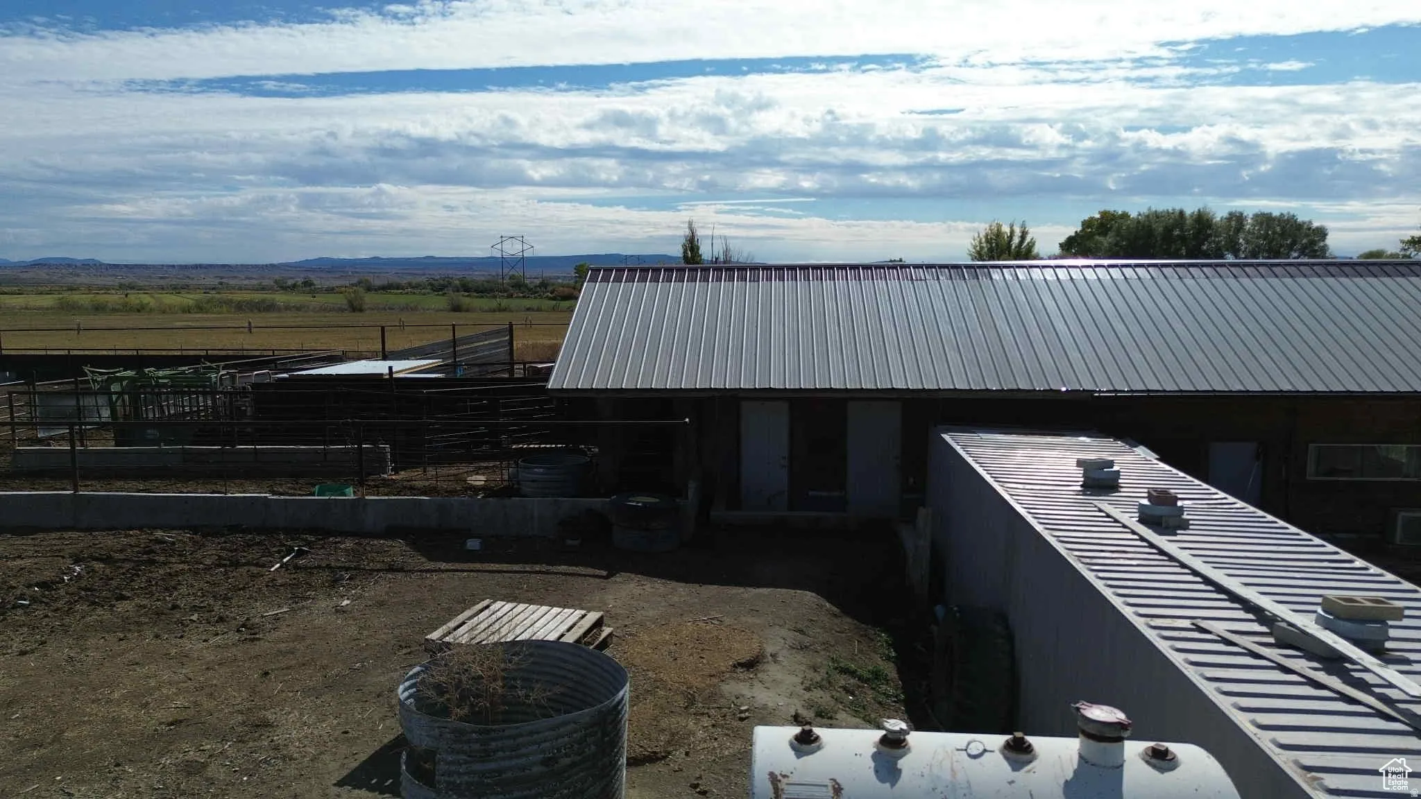 View of home's exterior with a view of countryside and a mountain view