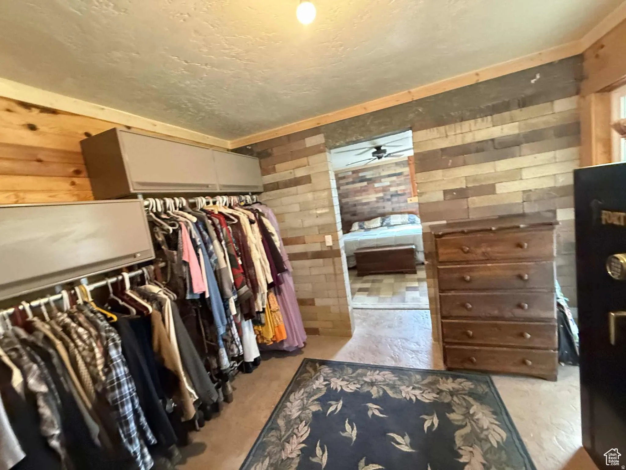 Spacious closet with ceiling fan