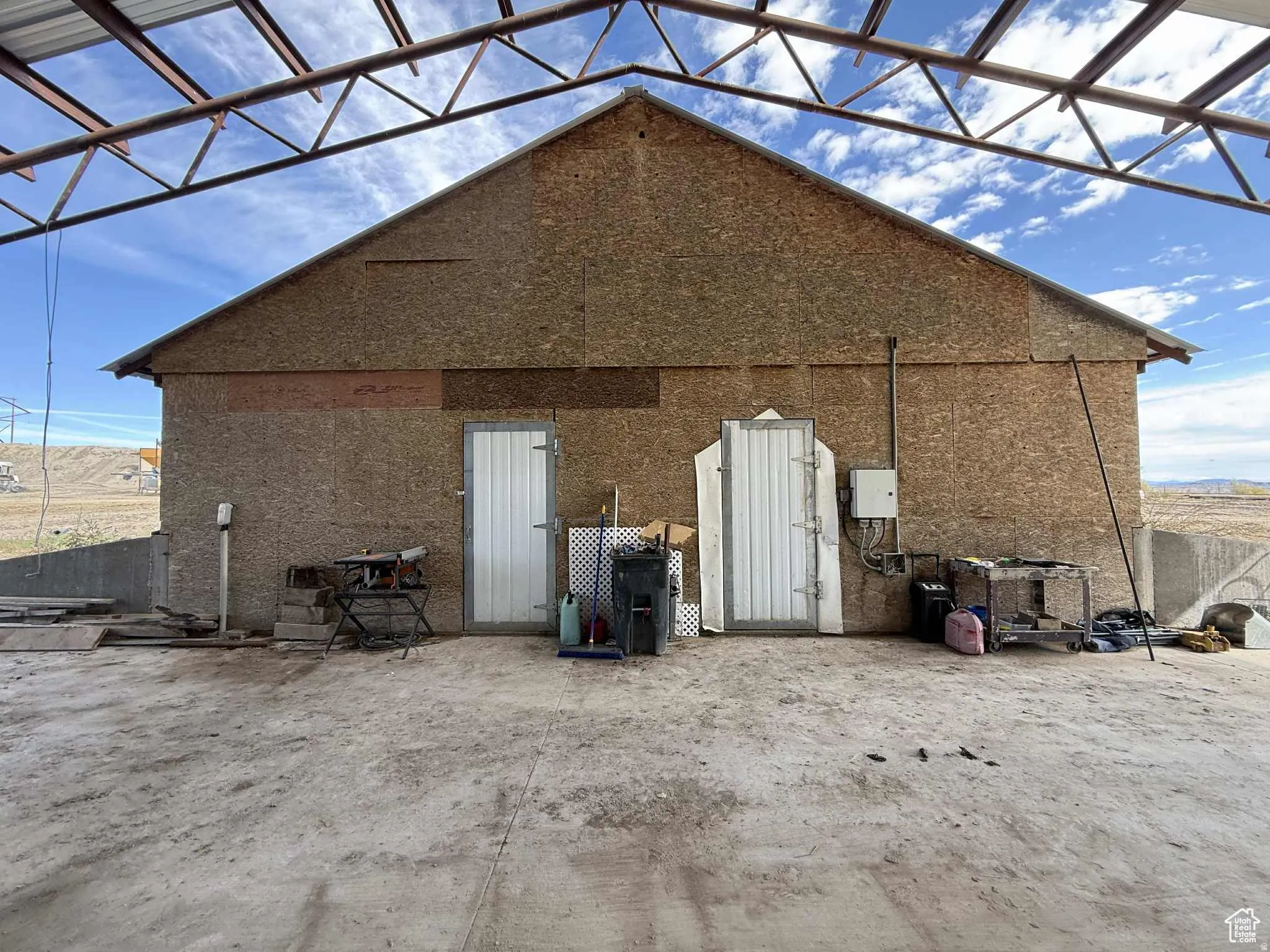 Rear view of property featuring stucco siding and a patio