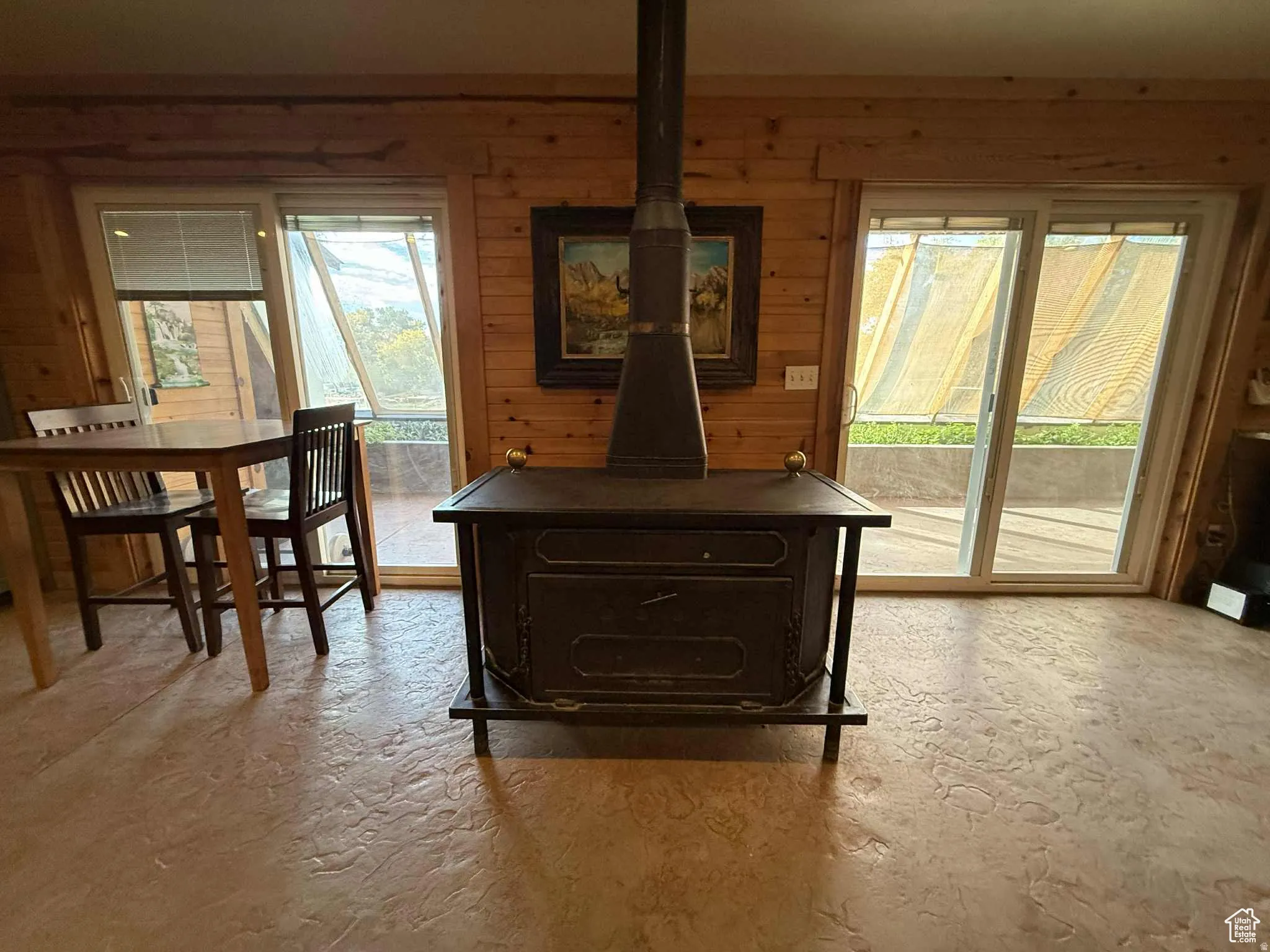 Detailed view of a wood stove and wood walls