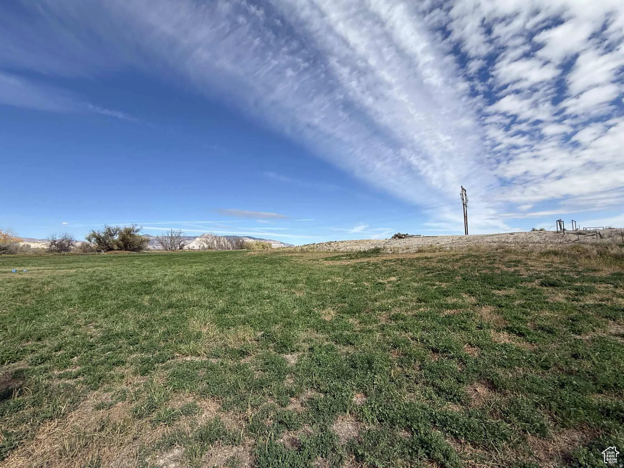 View of grassy yard featuring a view of rural / pastoral area
