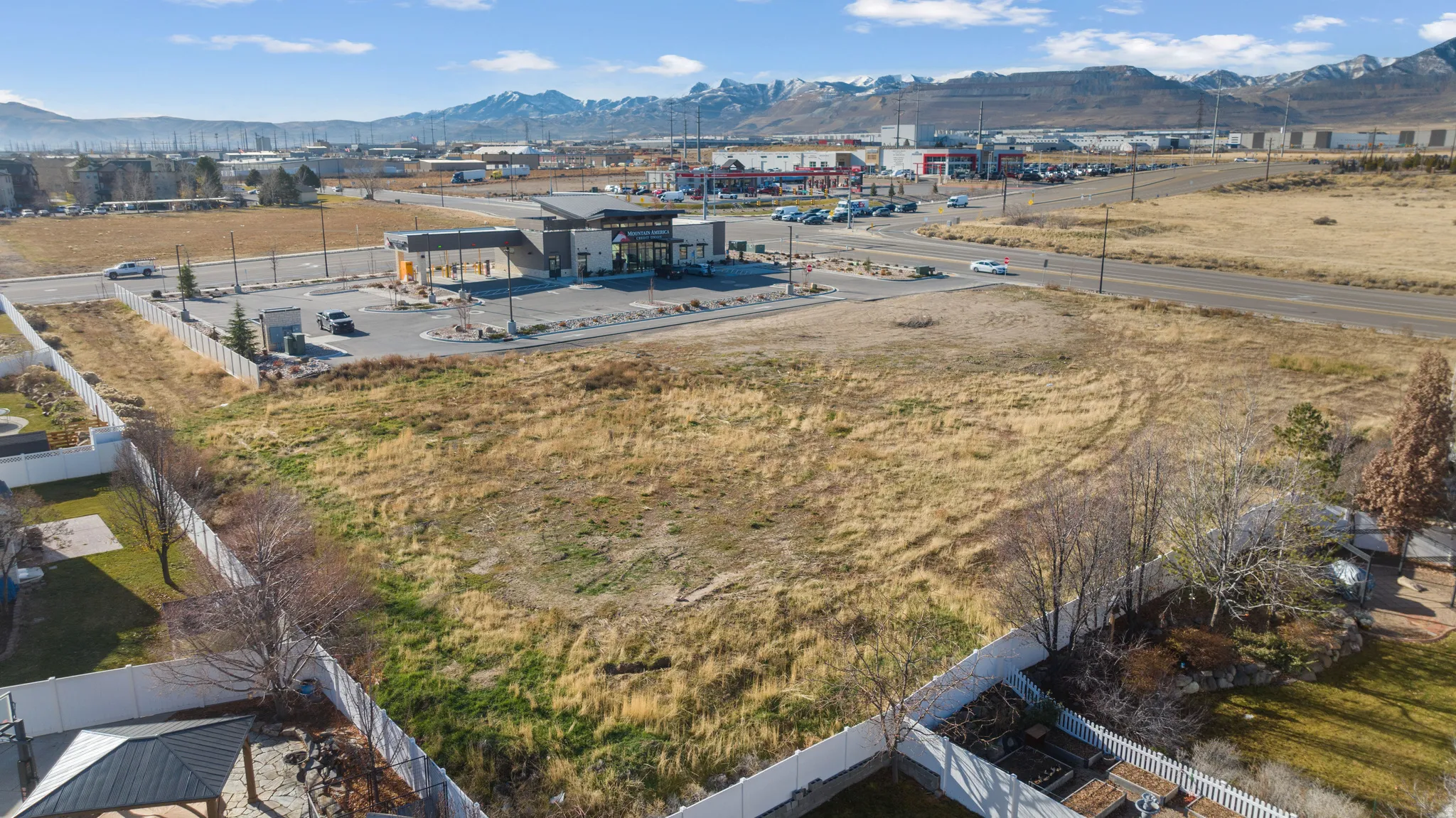 Aerial view of a mountain backdrop and industrial structures