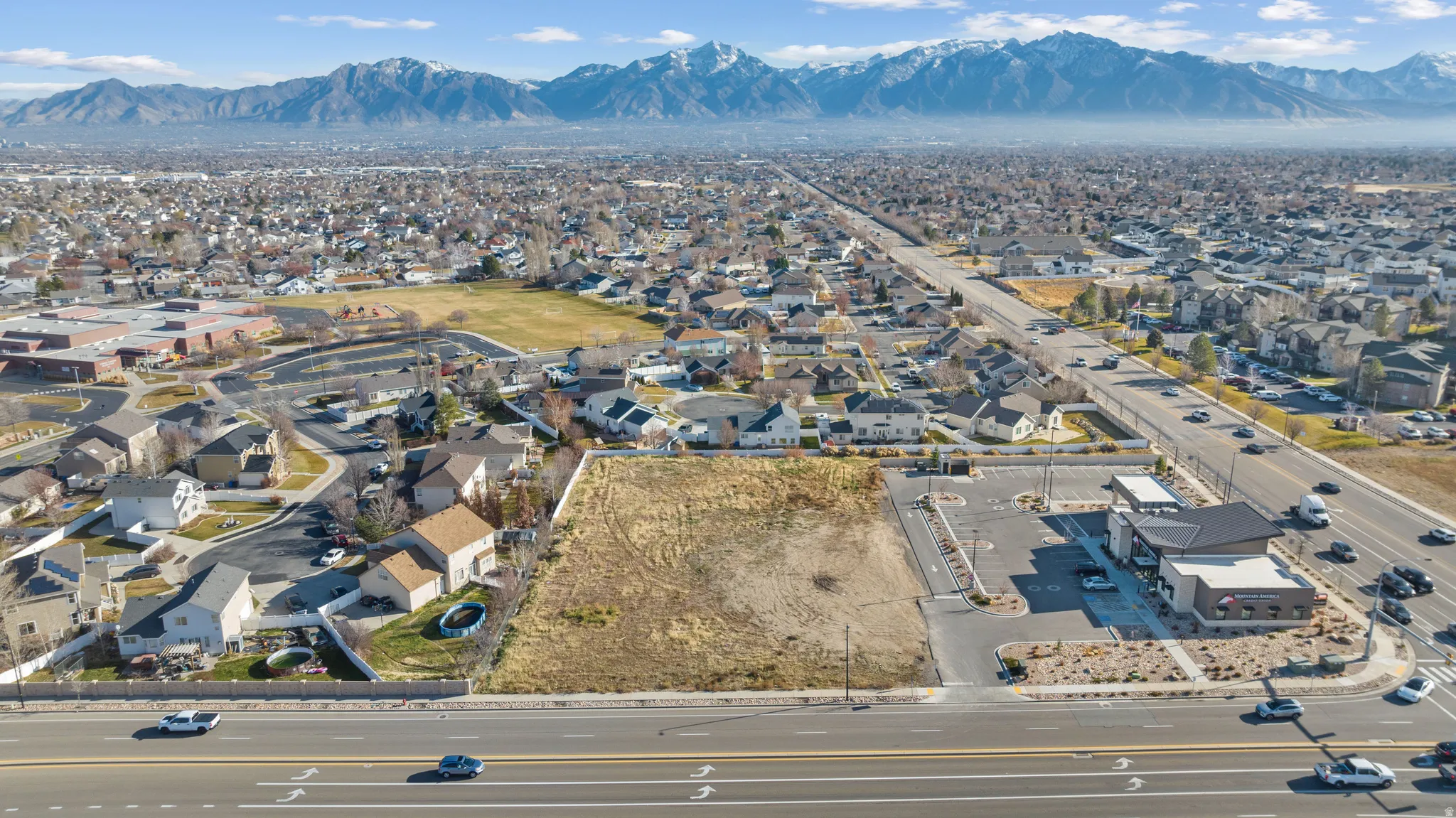 Aerial view of residential area featuring mountains
