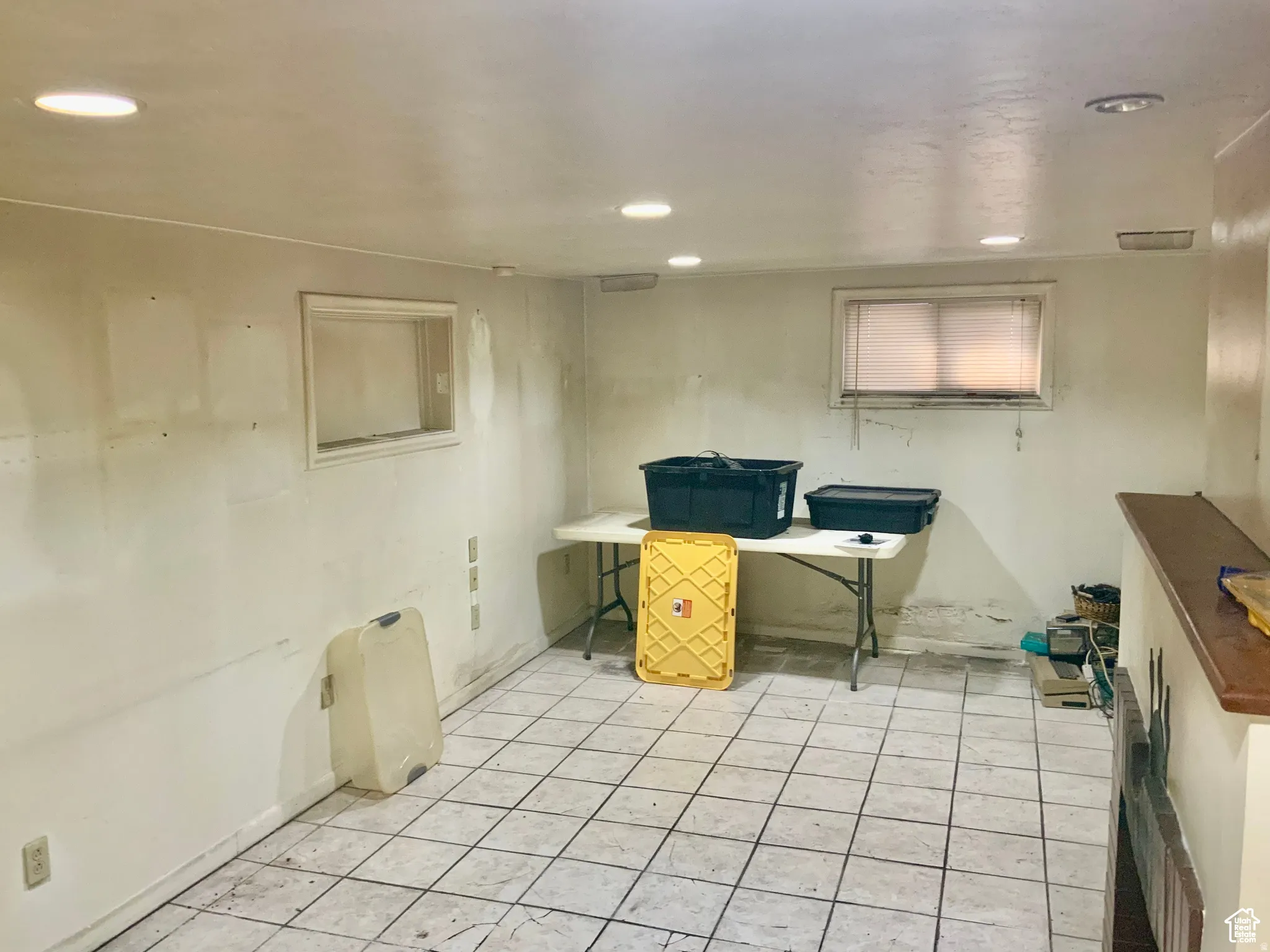 Office with recessed lighting and light tile patterned floors