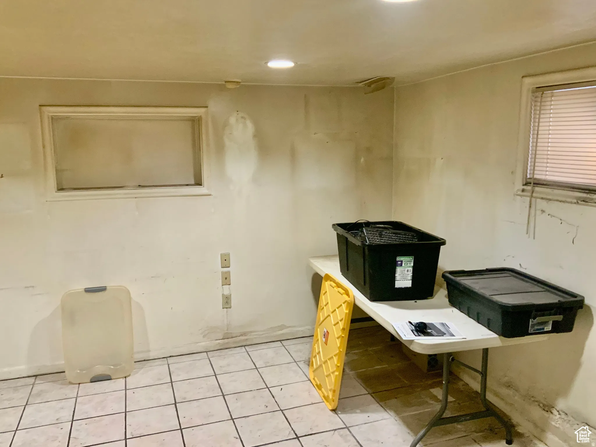 Misc room with light tile patterned floors and recessed lighting