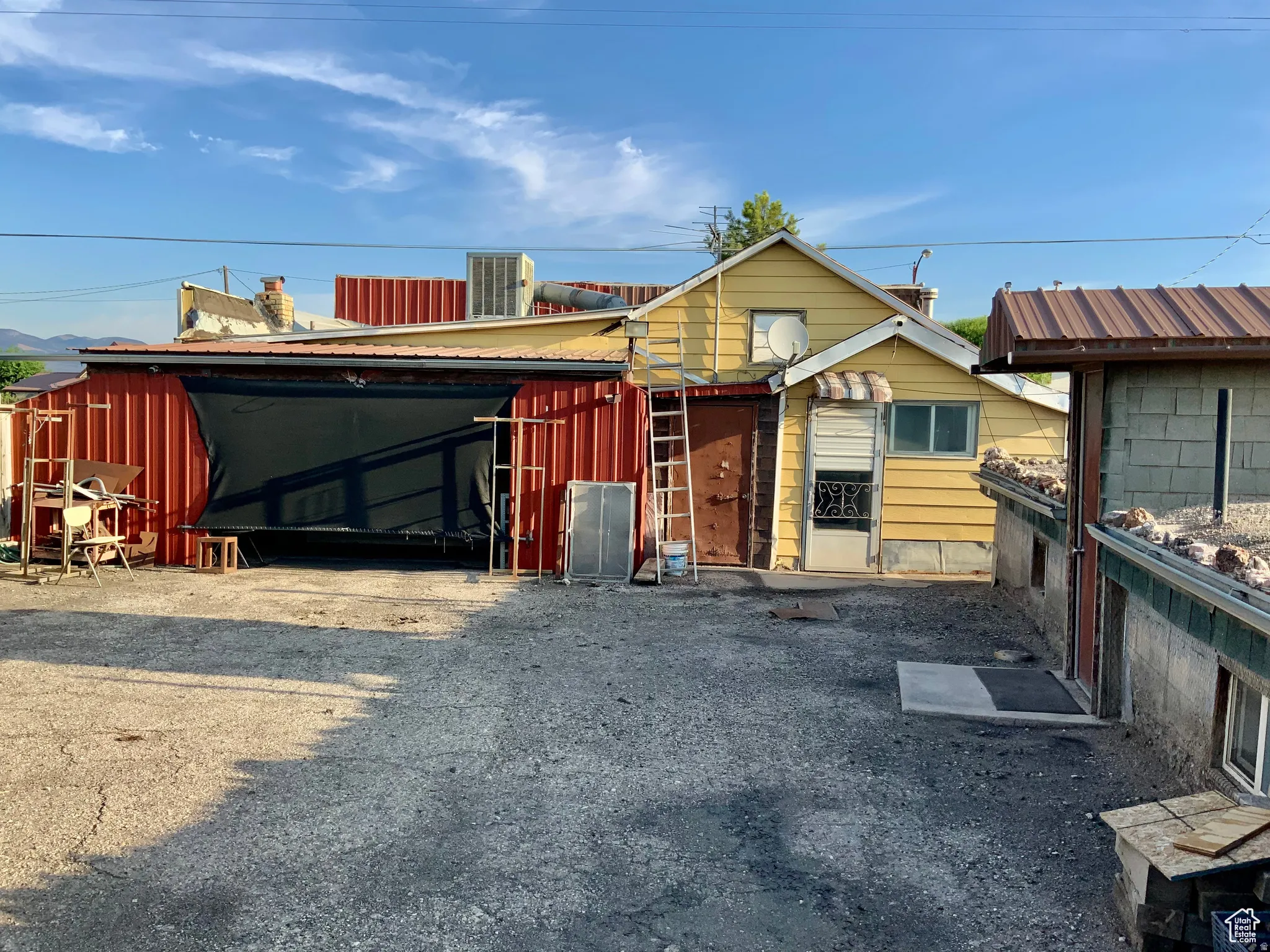 View of front of home featuring an outbuilding