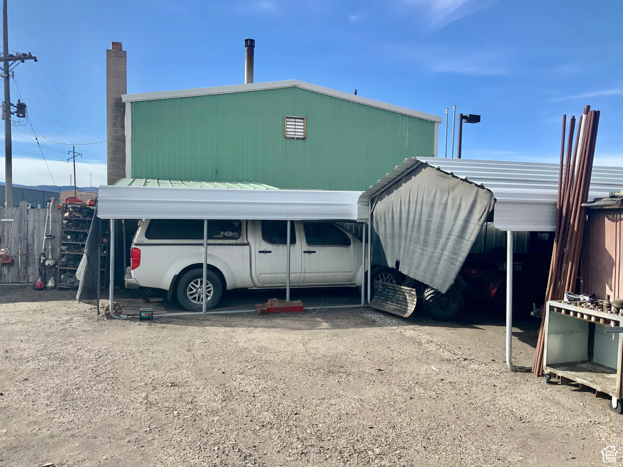 View of outbuilding with a carport