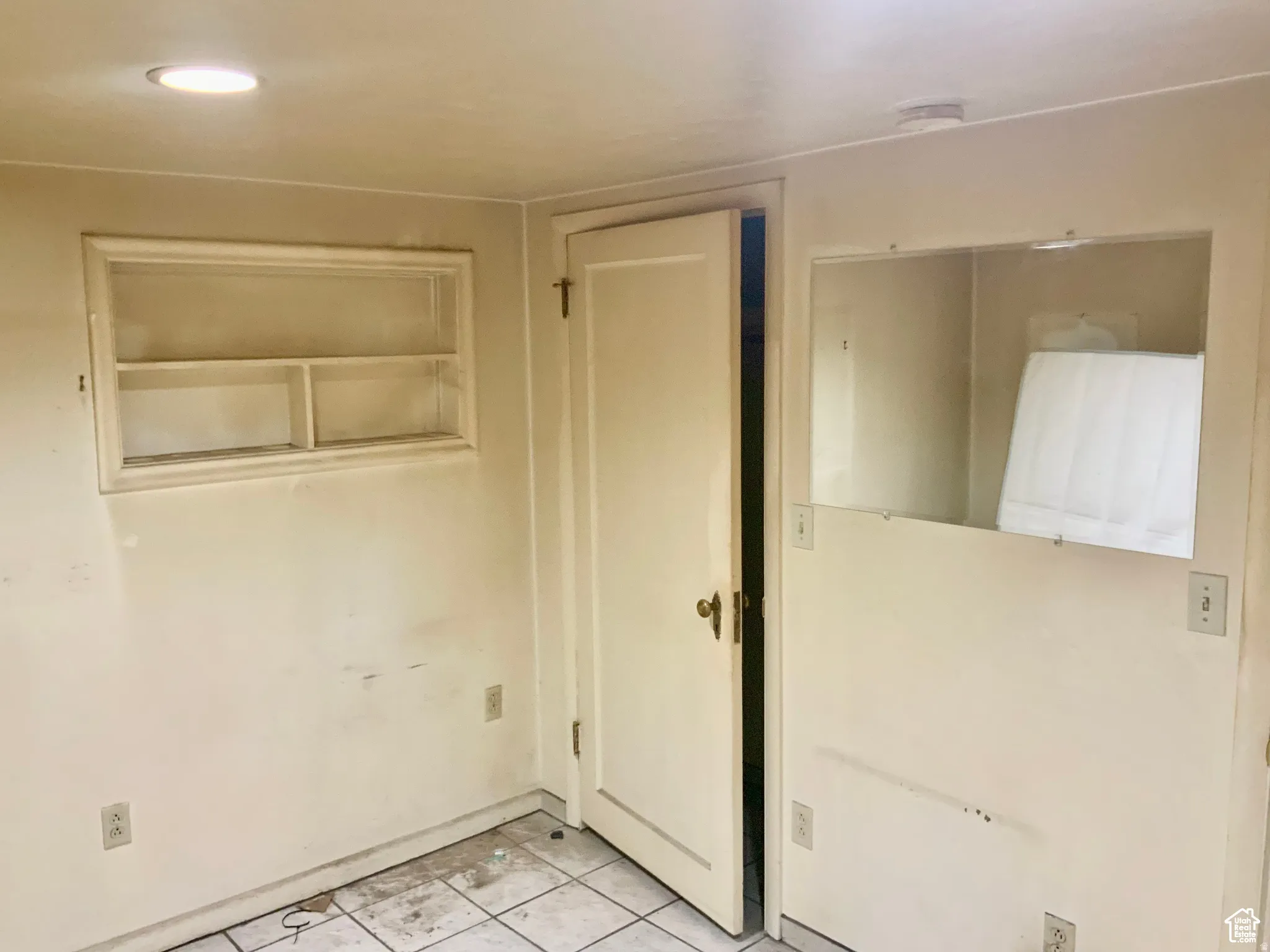 Unfurnished bedroom featuring light tile patterned flooring and recessed lighting