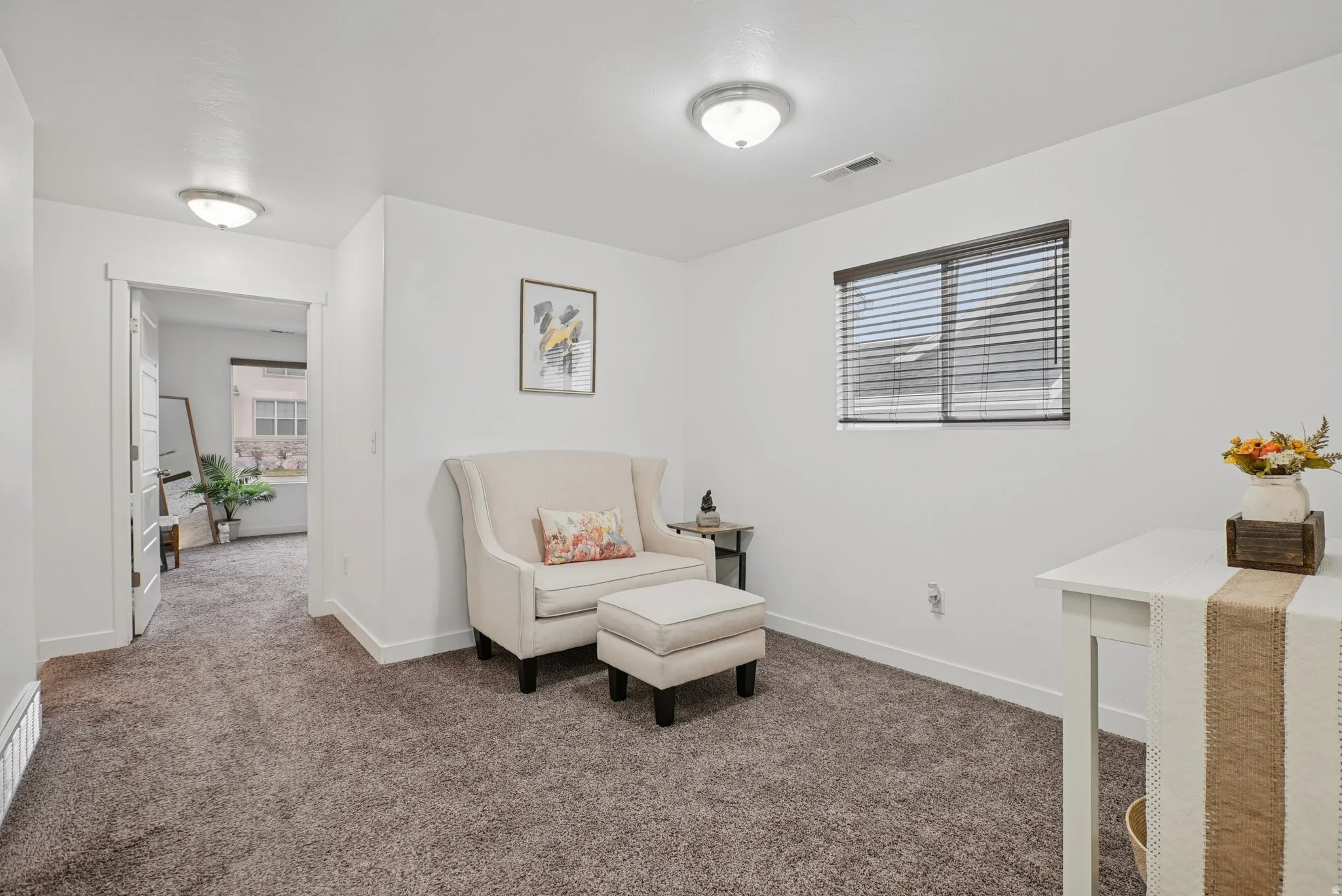 Living area with carpet flooring