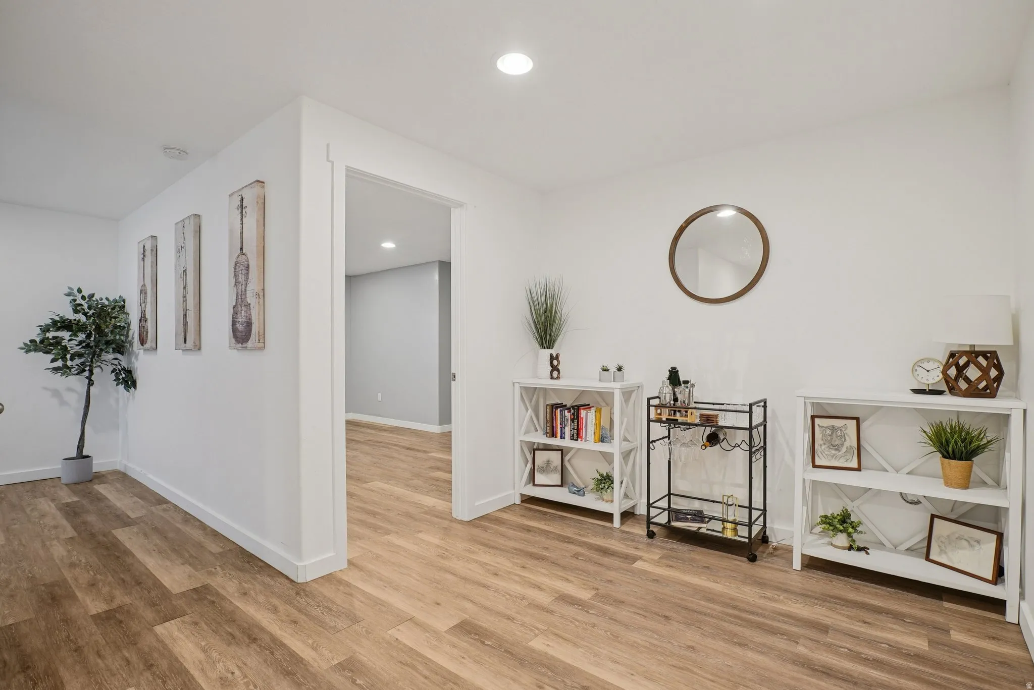 Sitting room featuring light wood finished floors and recessed lighting