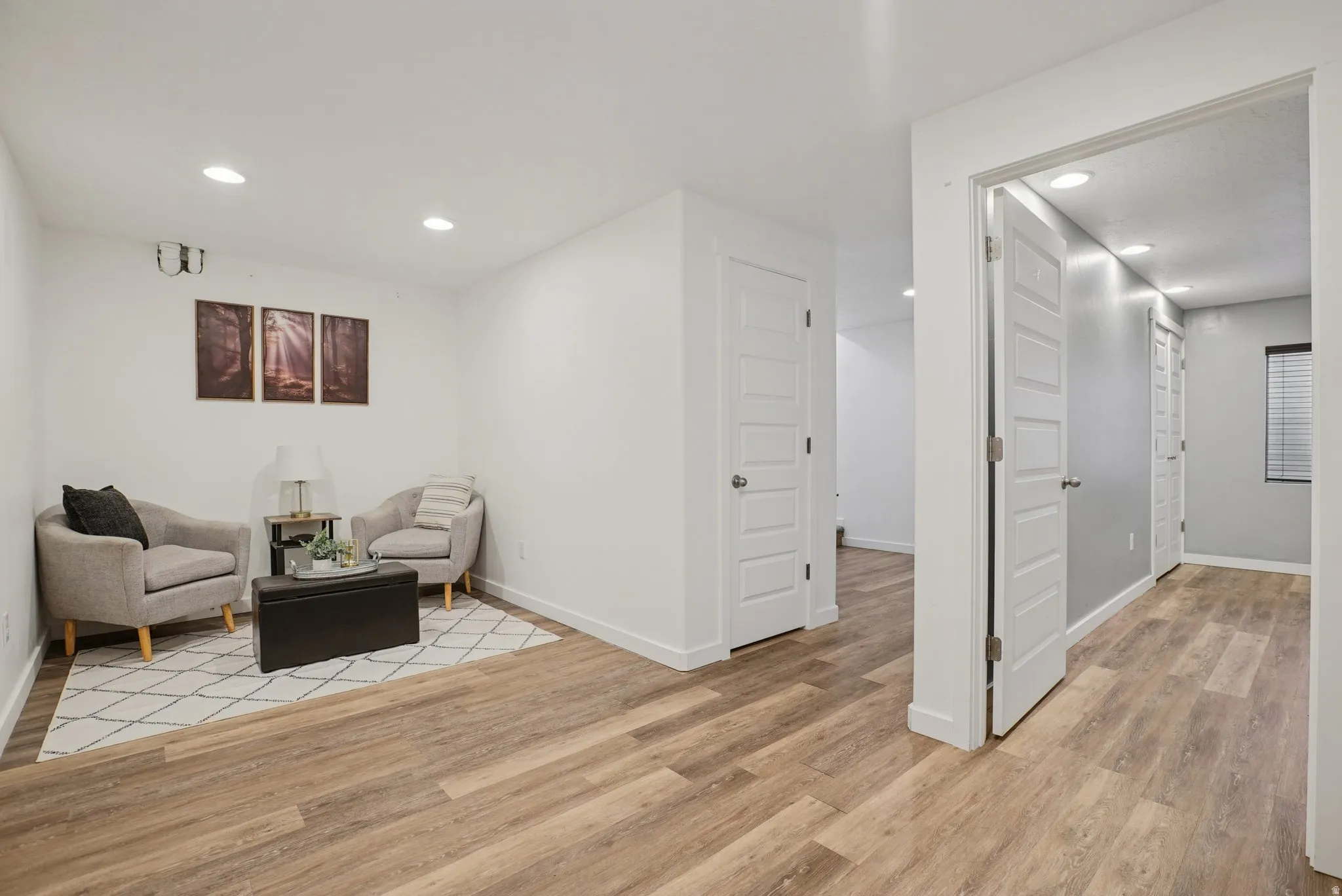 Sitting room featuring recessed lighting and light wood-style flooring