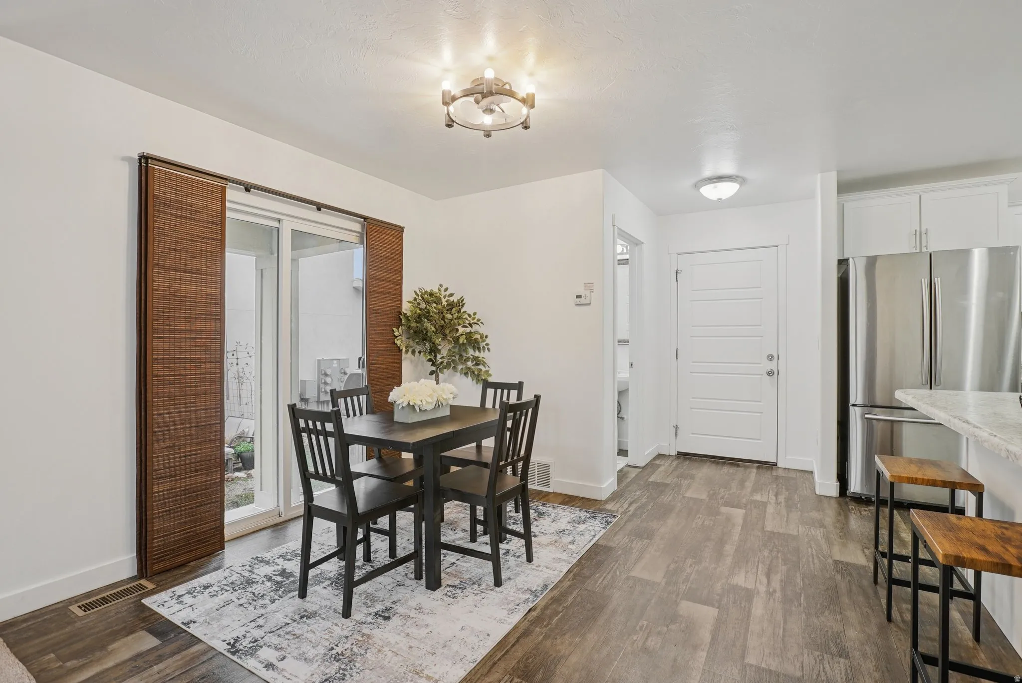 Dining area featuring dark wood finished floors