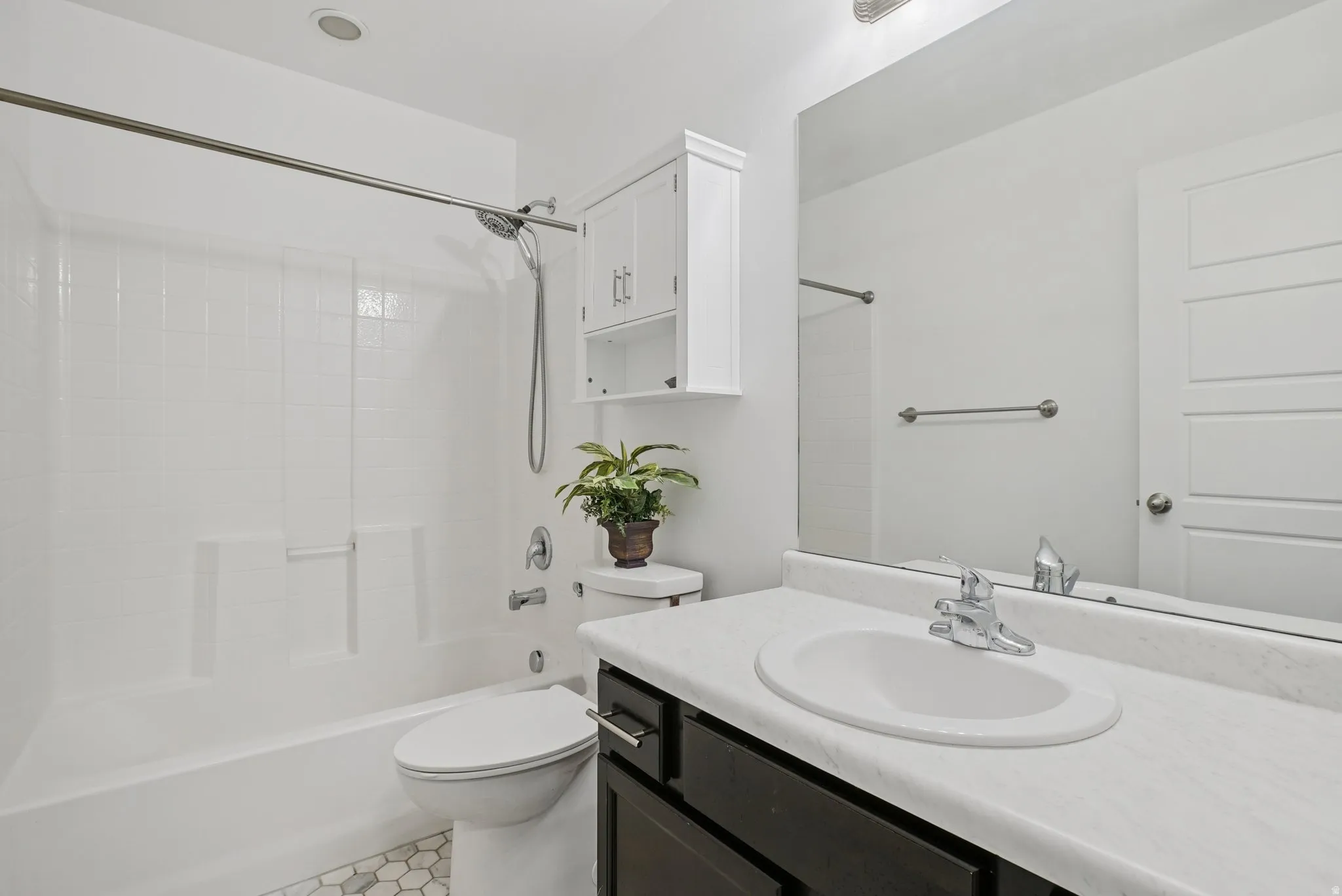 Full bath featuring vanity and tub / shower combination