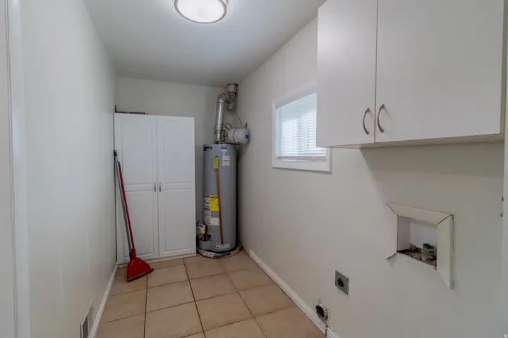 Utility room with gas water heater