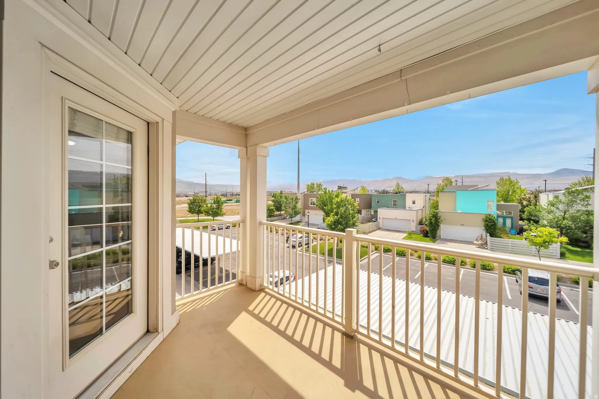 Balcony featuring a mountain view and a residential view