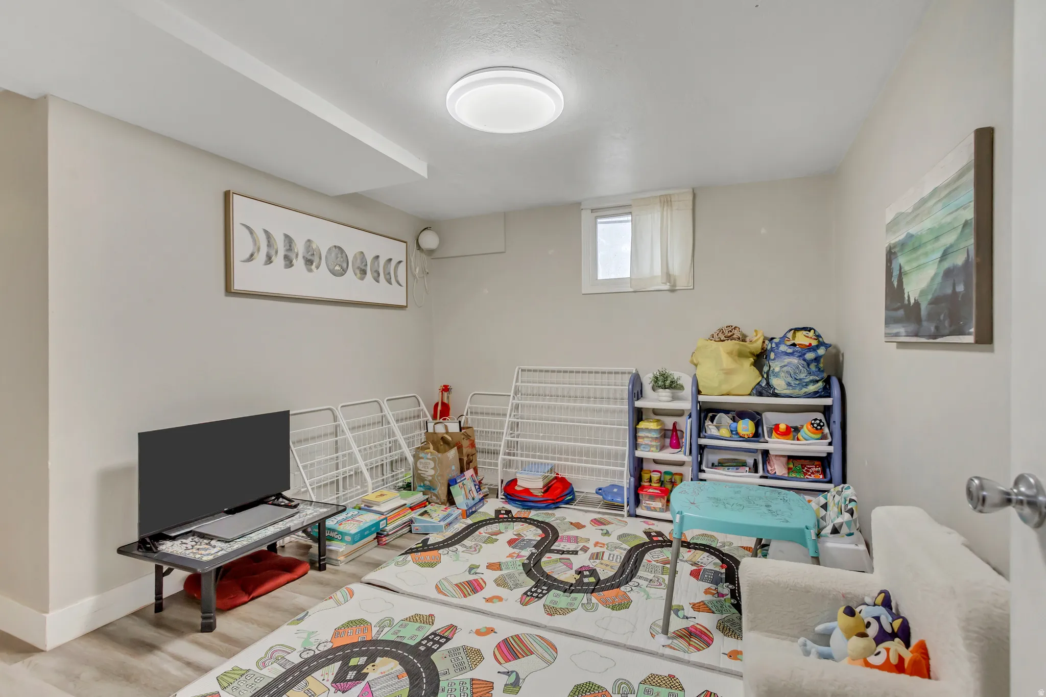Game room featuring wood finished floors