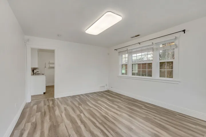 Empty room featuring light wood-style flooring and baseboards