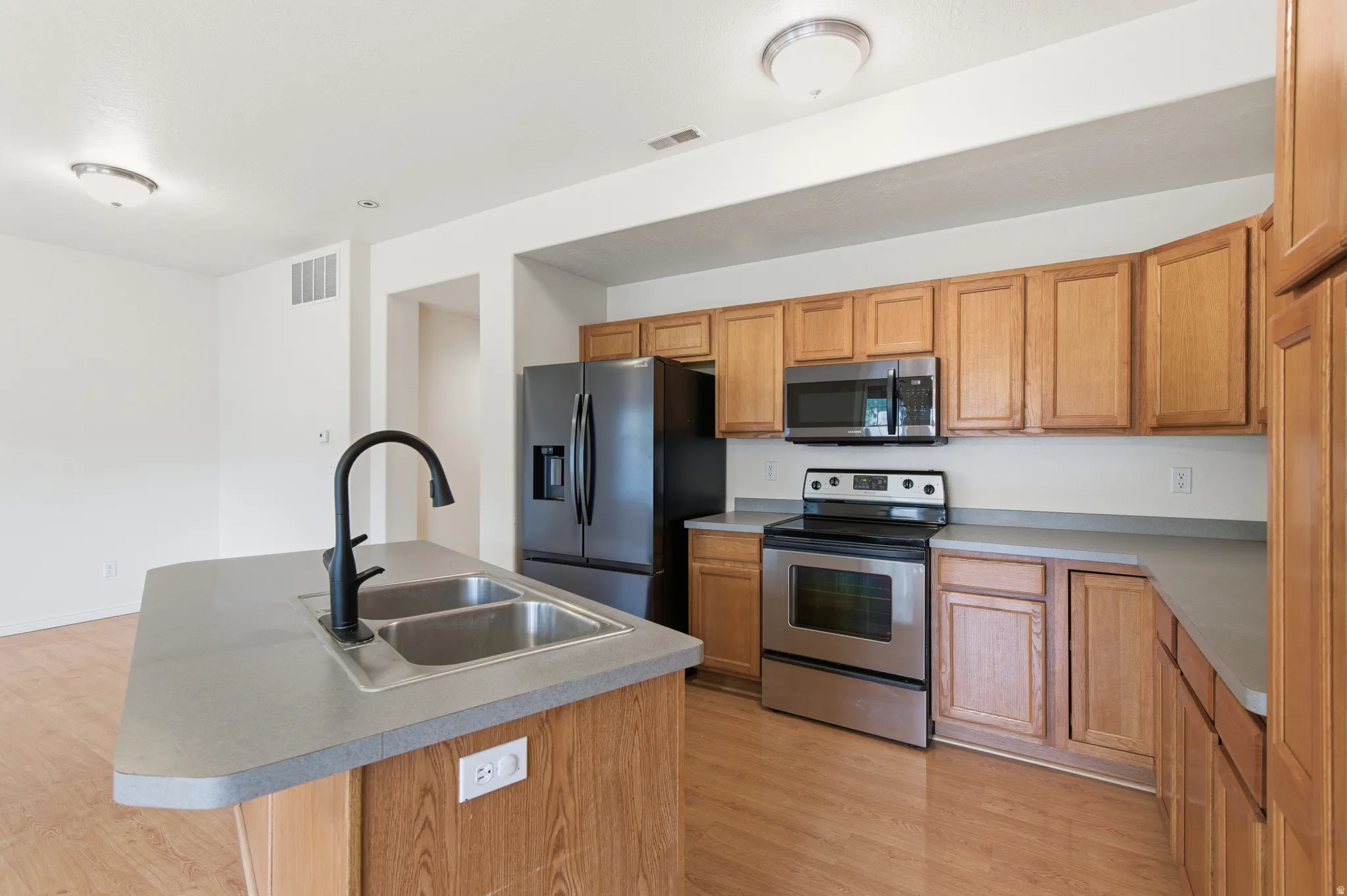 Kitchen with new refrigerator and microwave!