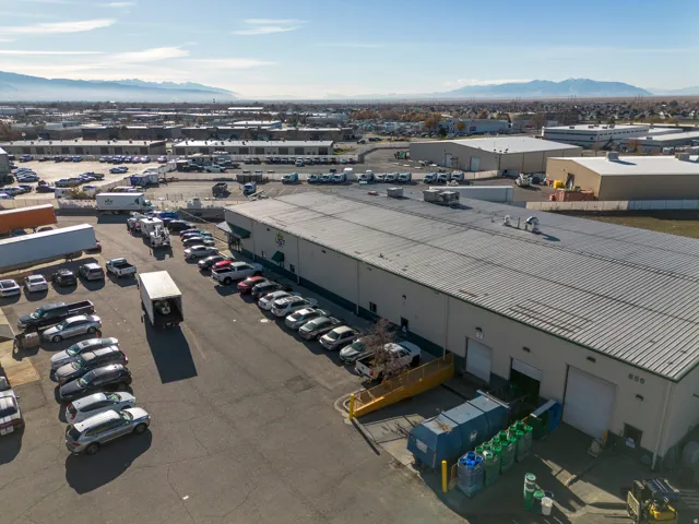 Drone / aerial view of an industrial area and mountains