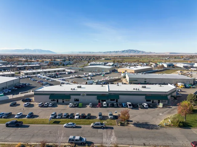 Bird's eye view of a mountainous background and industrial structures