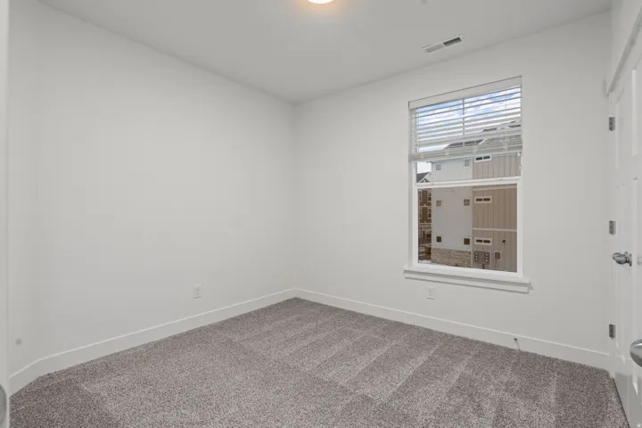 Spare room with carpet flooring and baseboards