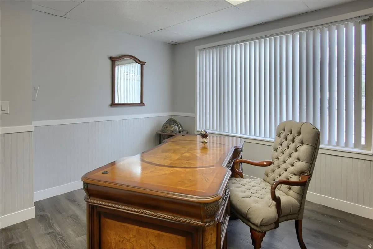 Office featuring a wainscoted wall